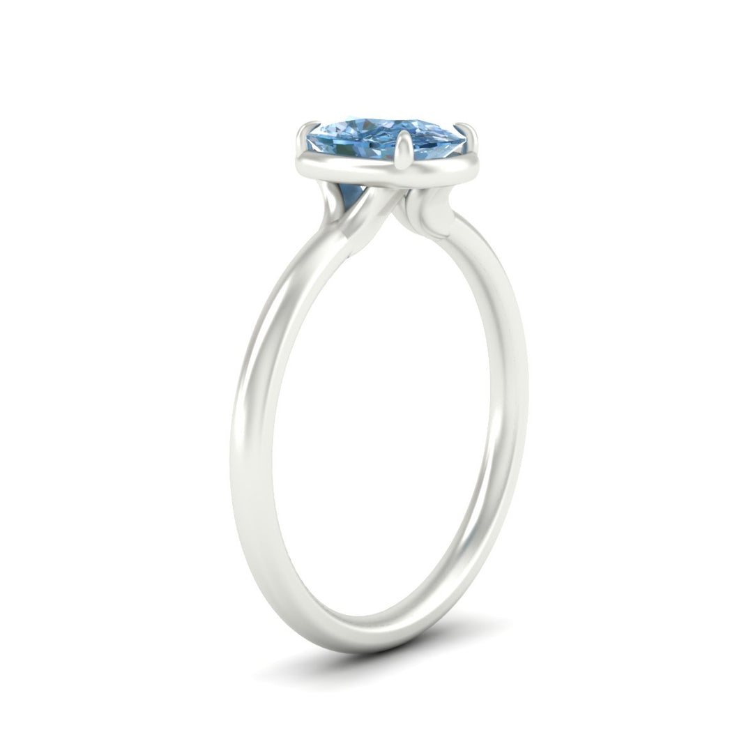 cushion-cut-collet-set-solitaire-vivid-blue-engagement-ring-in-white-gold-fdenr11593cugvblueangle2-nl-wg.jpg