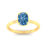 Load image into Gallery viewer, cushion-cut-collet-set-solitaire-vivid-blue-engagement-ring-in-yellow-gold-fdenr11593cugvblueangle5-nl-yg.jpg