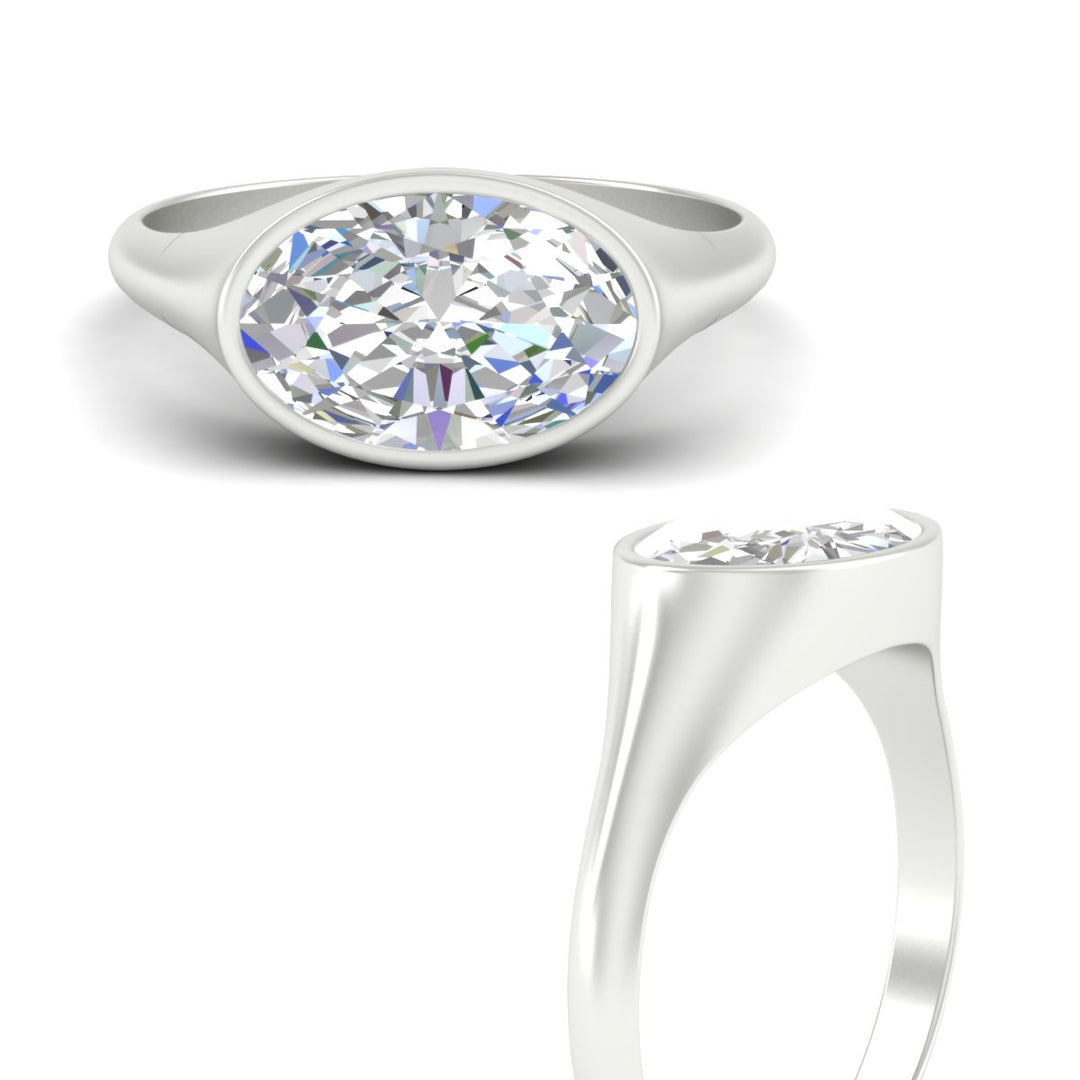 east-west-oval-bezel-diamond-engagement-ring-in-white-gold-fdenr11606angle3-nl-wg.jpg?v=1789038758