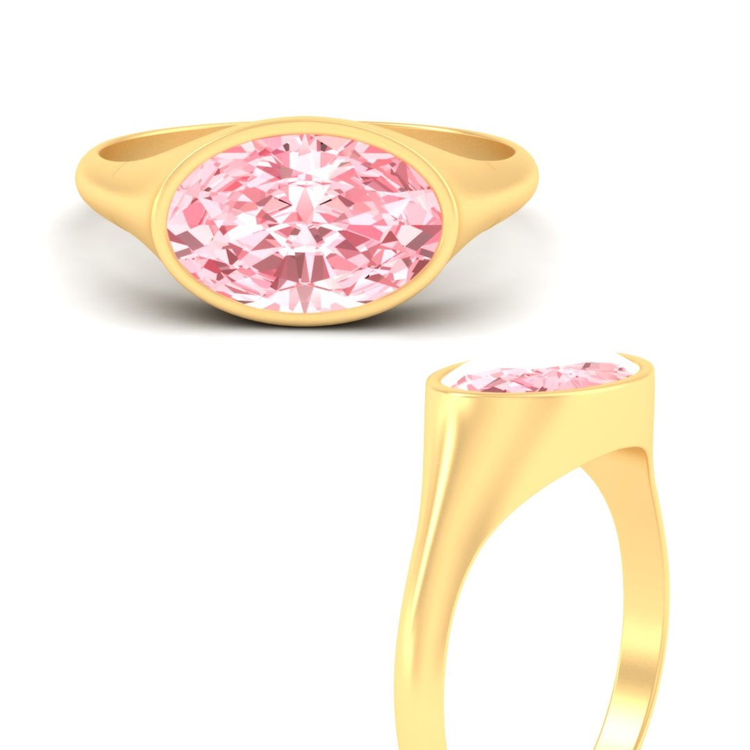 east-west-oval-bezel-vivid-pink-engagement-ring-in-yellow-gold-fdenr11606gvpinkangle3-nl-yg.jpg?v=1789038710