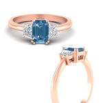 Load image into Gallery viewer, emerald-cut-vivid-blue-trapezoid-engagement-ring-in-rose-gold-fdenr7981emgvblueangle3-nl-rg.jpg?v=1788347229