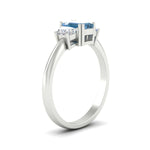 Load image into Gallery viewer, emerald-cut-vivid-blue-trapezoid-engagement-ring-in-white-gold-fdenr7981emgvblueangle2-nl-wg.jpg?v=1788347229