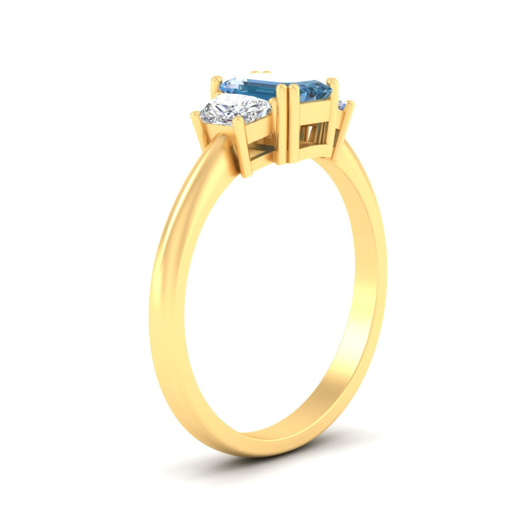 emerald-cut-vivid-blue-trapezoid-engagement-ring-in-yellow-gold-fdenr7981emgvblueangle2-nl-yg.jpg?v=1788347229