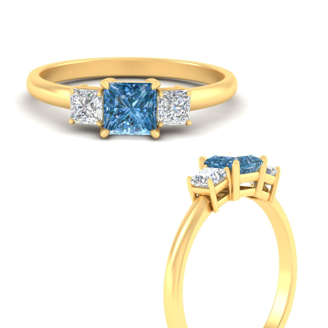 fancy-vivid-blue-lab-princess-cut-three-stone-ring-in-yellow-gold-fdenr2375prgvblueangle3-nl-yg_96f8a1d7-9297-4f12-966e-3f898c682ecf.jpg?v=1787893554