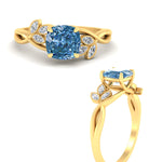 Load image into Gallery viewer, floral-leaf-cushion-cut-vivid-blue-engagement-ring-in-yellow-gold-fdenr10962cugvblueangle3-nl-yg.jpg