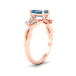 Load image into Gallery viewer, floral-leaf-emerald-cut-vivid-blue-engagement-ring-in-rose-gold-fdenr10962emgvblueangle2-nl-rg.jpg