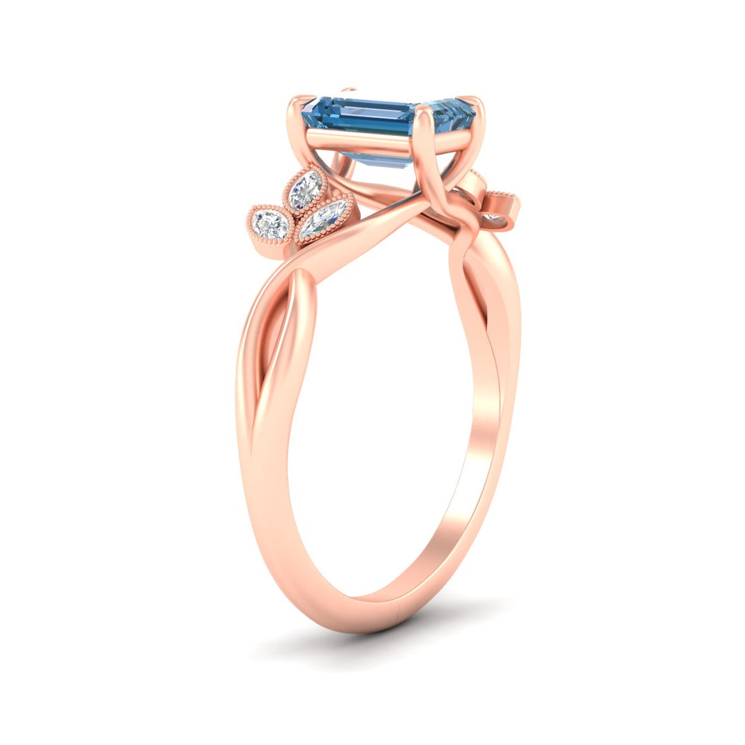 floral-leaf-emerald-cut-vivid-blue-engagement-ring-in-rose-gold-fdenr10962emgvblueangle2-nl-rg.jpg