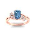 Load image into Gallery viewer, floral-leaf-emerald-cut-vivid-blue-engagement-ring-in-rose-gold-fdenr10962emgvblueangle5-nl-rg.jpg