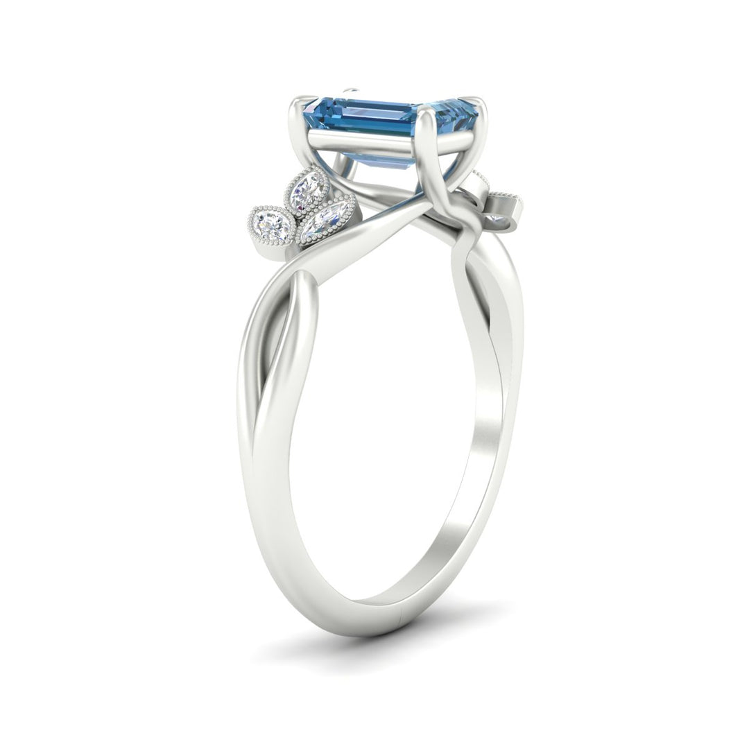 floral-leaf-emerald-cut-vivid-blue-engagement-ring-in-white-gold-fdenr10962emgvblueangle2-nl-wg.jpg