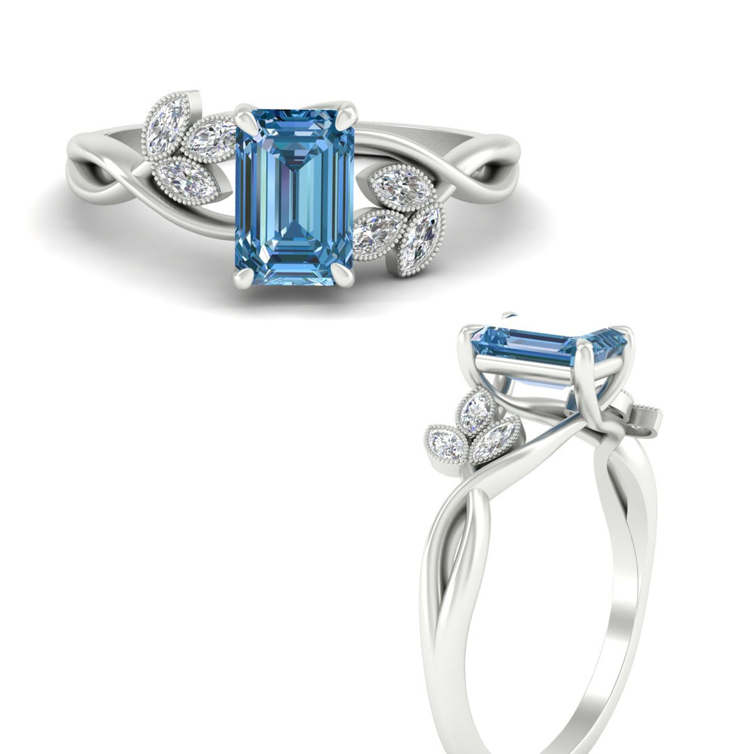 floral-leaf-emerald-cut-vivid-blue-engagement-ring-in-white-gold-fdenr10962emgvblueangle3-nl-wg.jpg