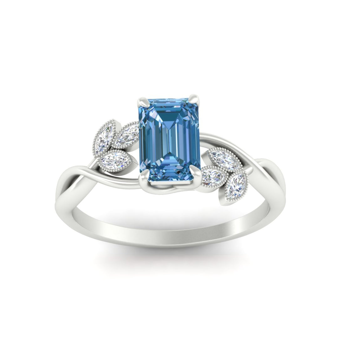 floral-leaf-emerald-cut-vivid-blue-engagement-ring-in-white-gold-fdenr10962emgvblueangle5-nl-wg.jpg