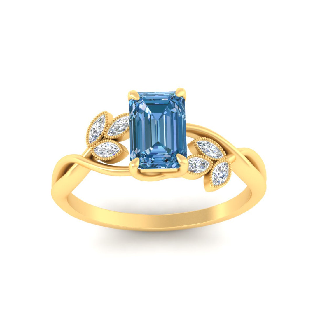 floral-leaf-emerald-cut-vivid-blue-engagement-ring-in-yellow-gold-fdenr10962emgvblueangle5-nl-yg.jpg