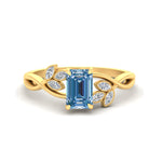 Load image into Gallery viewer, floral-leaf-emerald-cut-vivid-blue-engagement-ring-in-yellow-gold-fdenr10962emgvbluesleep-nl-yg.jpg