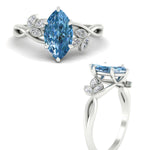 Load image into Gallery viewer, floral-leaf-marquise-cut-vivid-blue-engagement-ring-in-white-gold-fdenr10962mqgvblueangle3-nl-wg.jpg