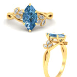 Load image into Gallery viewer, floral-leaf-marquise-cut-vivid-blue-engagement-ring-in-yellow-gold-fdenr10962mqgvblueangle3-nl-yg.jpg