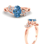 Load image into Gallery viewer, floral-leaf-oval-shaped-vivid-blue-engagement-ring-in-rose-gold-fdenr10962ovgvblueangle3-nl-rg.jpg