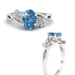 Load image into Gallery viewer, floral-leaf-oval-shaped-vivid-blue-engagement-ring-in-white-gold-fdenr10962ovgvblueangle3-nl-wg.jpg