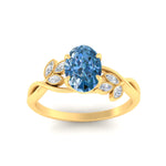 Load image into Gallery viewer, floral-leaf-oval-shaped-vivid-blue-engagement-ring-in-yellow-gold-fdenr10962ovgvblueangle5-nl-yg.jpg