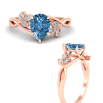 Load image into Gallery viewer, floral-leaf-pear-shaped-vivid-blue-engagement-ring-in-rose-gold-fdenr10962pegvblueangle3-nl-rg.jpg