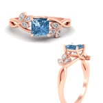 Load image into Gallery viewer, floral-leaf-princess-cut-vivid-blue-engagement-ring-in-rose-gold-fdenr10962prgvblueangle3-nl-rg.jpg