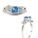 Load image into Gallery viewer, floral-leaf-princess-cut-vivid-blue-engagement-ring-in-white-gold-fdenr10962prgvblueangle3-nl-wg.jpg