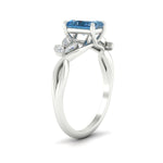 Load image into Gallery viewer, floral-leaf-radiant-cut-vivid-blue-engagement-ring-in-white-gold-fdenr10962ragvblueangle2-nl-wg.jpg