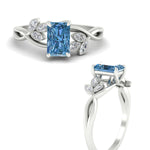 Load image into Gallery viewer, floral-leaf-radiant-cut-vivid-blue-engagement-ring-in-white-gold-fdenr10962ragvblueangle3-nl-wg.jpg