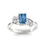 Load image into Gallery viewer, floral-leaf-radiant-cut-vivid-blue-engagement-ring-in-white-gold-fdenr10962ragvblueangle5-nl-wg.jpg