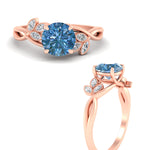 Load image into Gallery viewer, floral-leaf-round-cut-vivid-blue-engagement-ring-in-rose-gold-fdenr10962rogvblueangle3-nl-rg.jpg