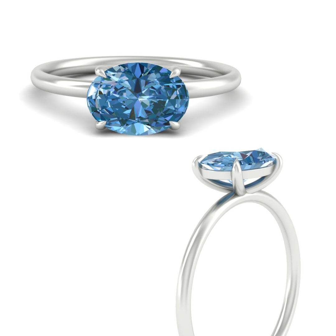 horizontal-oval-4-prong-vivid-blue-engagement-ring-in-white-gold-fd11749ovrgvblueangle3-nl-wg.jpg?v=1788845173