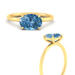 Load image into Gallery viewer, horizontal-oval-4-prong-vivid-blue-engagement-ring-in-yellow-gold-fd11749ovrgvblueangle3-nl-yg.jpg?v=1788845173