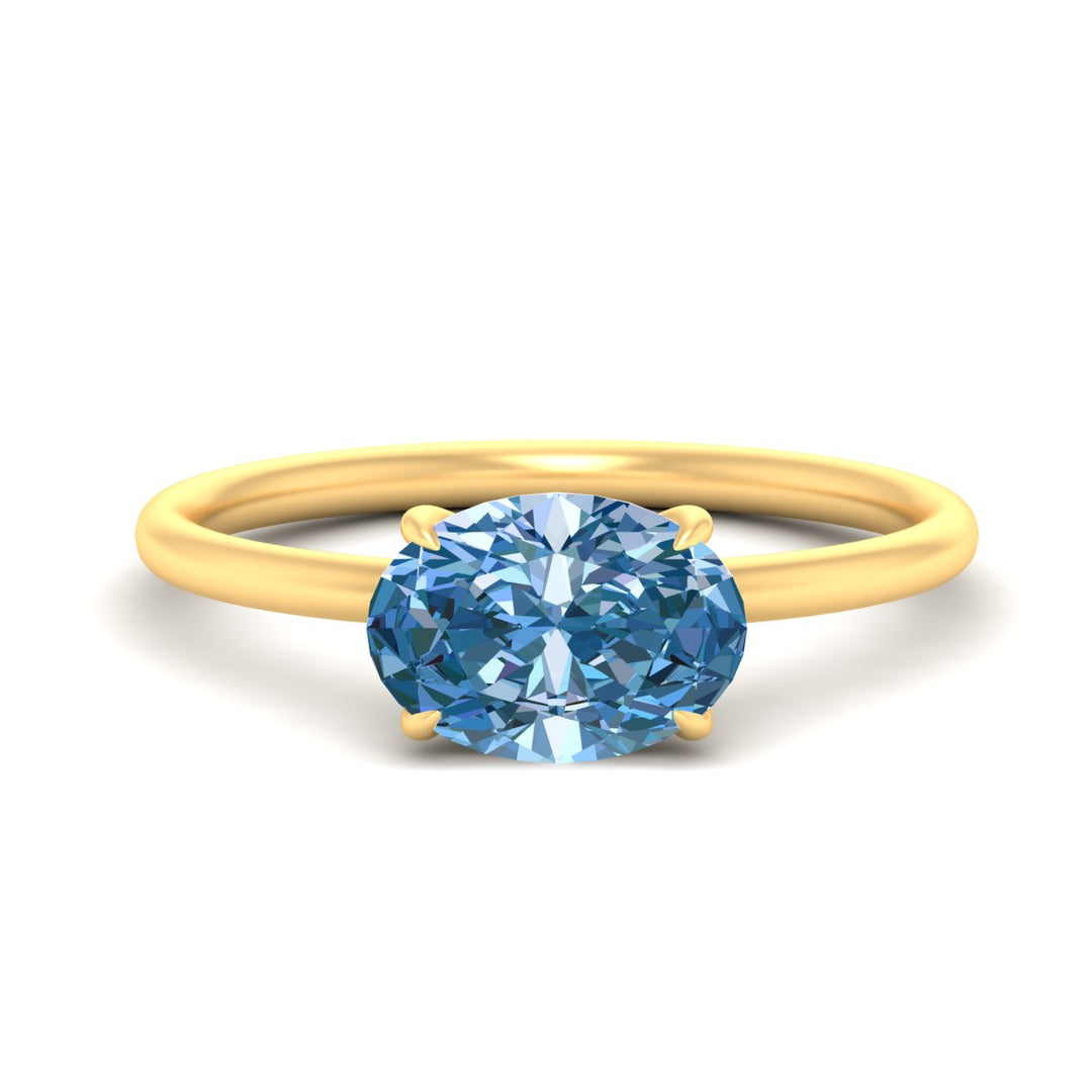 horizontal-oval-4-prong-vivid-blue-engagement-ring-in-yellow-gold-fd11749ovrgvbluesleep-nl-yg.jpg?v=1788845172
