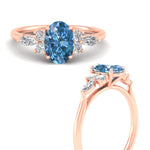 Load image into Gallery viewer, oval-cut-vivid-blue-marquise-floral-engagement-ring-in-rose-gold-fdenr11764ovgvblueangle3-nl-rg.jpg