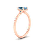 Load image into Gallery viewer, oval-shaped-collet-set-solitaire-vivid-blue-engagement-ring-in-rose-gold-fdenr11593ovgvblueangle2-nl-rg.jpg