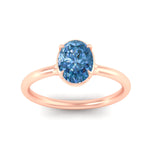 Load image into Gallery viewer, oval-shaped-collet-set-solitaire-vivid-blue-engagement-ring-in-rose-gold-fdenr11593ovgvblueangle5-nl-rg.jpg