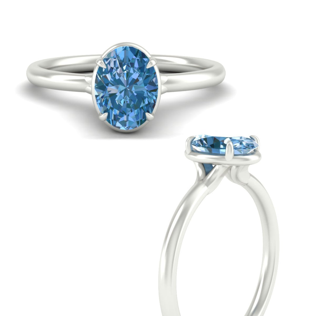 oval-shaped-collet-set-solitaire-vivid-blue-engagement-ring-in-white-gold-fdenr11593ovgvblueangle3-nl-wg.jpg