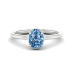 Load image into Gallery viewer, oval-shaped-collet-set-solitaire-vivid-blue-engagement-ring-in-white-gold-fdenr11593ovgvbluesleep-nl-wg.jpg