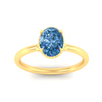 Load image into Gallery viewer, oval-shaped-collet-set-solitaire-vivid-blue-engagement-ring-in-yellow-gold-fdenr11593ovgvblueangle5-nl-yg.jpg