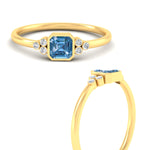 Load image into Gallery viewer, petite-bezel-set-asscher-cut-vivid-blue-engagement-ring-in-yellow-gold-fdenr9175asgvblueangle3-nl-yg.jpg