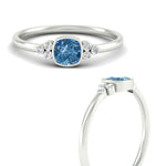 Load image into Gallery viewer, petite-bezel-set-cushion-cut-vivid-blue-engagement-ring-in-white-gold-fdenr9175cugvblueangle3-nl-wg.jpg