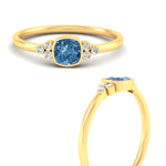 Load image into Gallery viewer, petite-bezel-set-cushion-cut-vivid-blue-engagement-ring-in-yellow-gold-fdenr9175cugvblueangle3-nl-yg.jpg