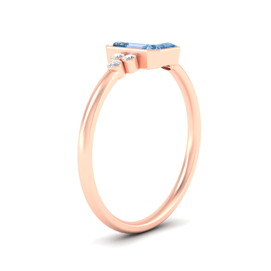 petite-bezel-set-emerald-cut-vivid-blue-engagement-ring-in-rose-gold-fdenr9175emgvblueangle2-nl-rg.jpg