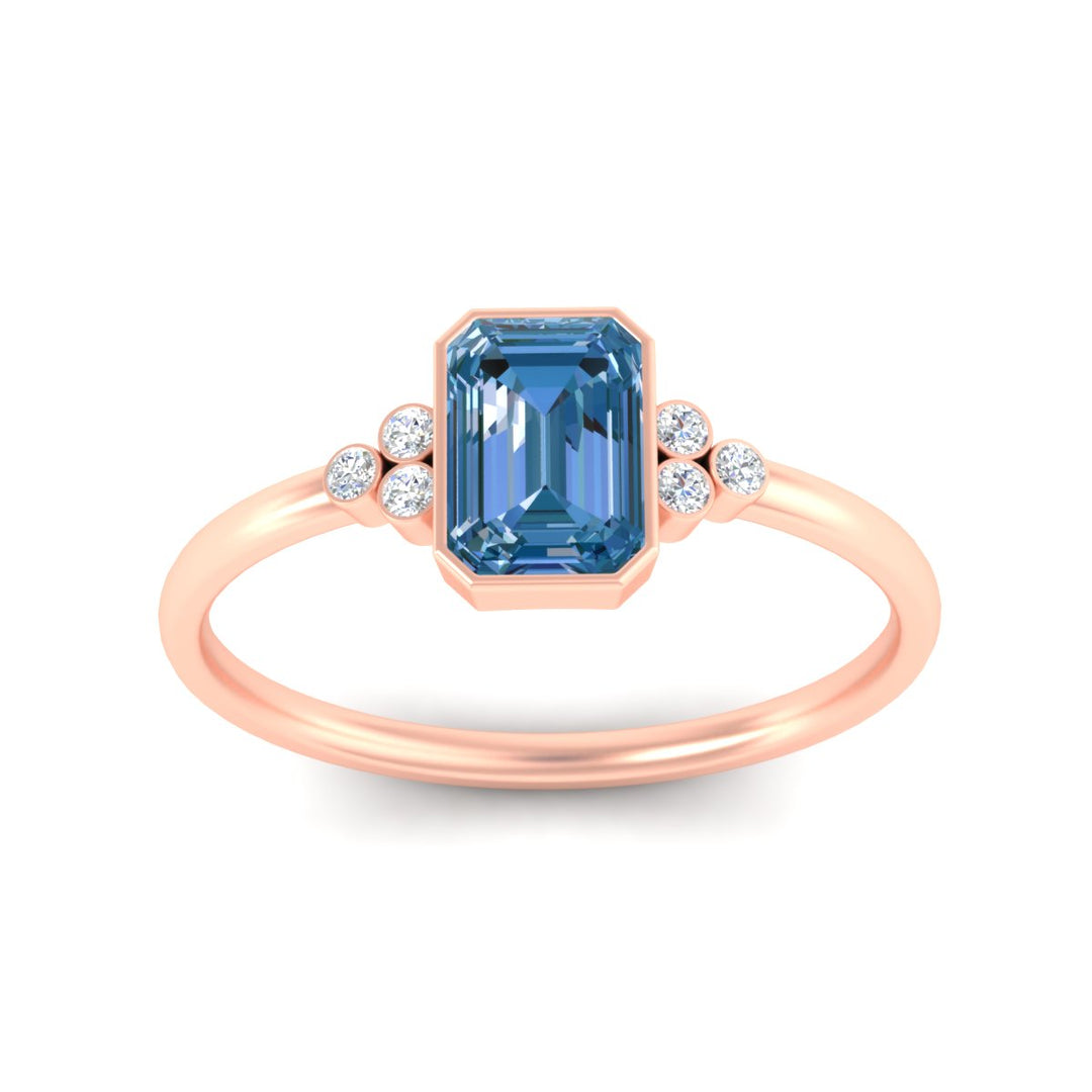 petite-bezel-set-emerald-cut-vivid-blue-engagement-ring-in-rose-gold-fdenr9175emgvblueangle5-nl-rg.jpg