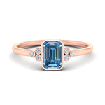Load image into Gallery viewer, petite-bezel-set-emerald-cut-vivid-blue-engagement-ring-in-rose-gold-fdenr9175emgvbluesleep-nl-rg.jpg
