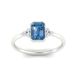 Load image into Gallery viewer, petite-bezel-set-emerald-cut-vivid-blue-engagement-ring-in-white-gold-fdenr9175emgvblueangle5-nl-wg.jpg