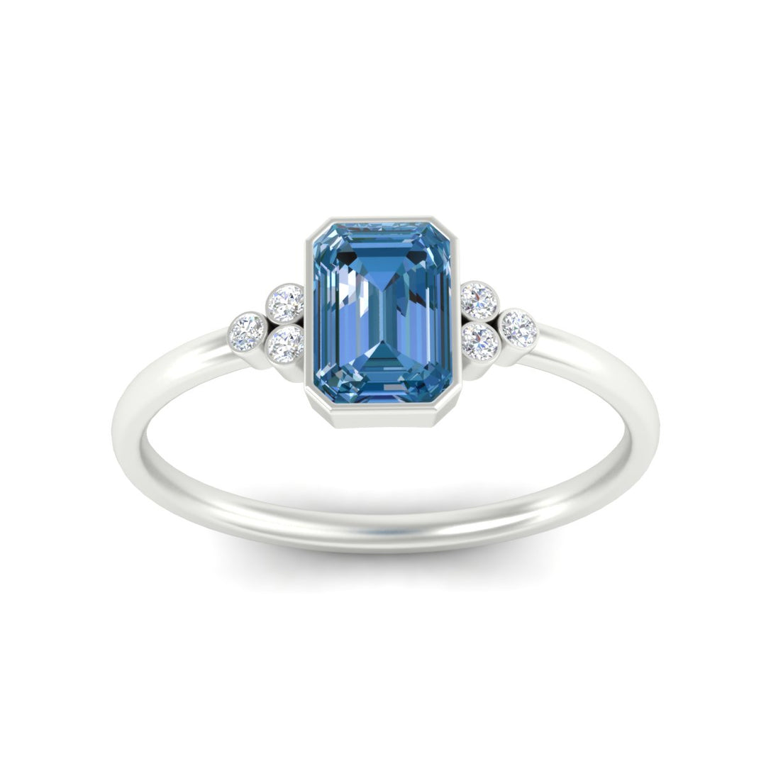 petite-bezel-set-emerald-cut-vivid-blue-engagement-ring-in-white-gold-fdenr9175emgvblueangle5-nl-wg.jpg