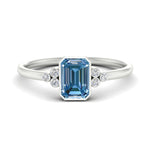 Load image into Gallery viewer, petite-bezel-set-emerald-cut-vivid-blue-engagement-ring-in-white-gold-fdenr9175emgvbluesleep-nl-wg.jpg