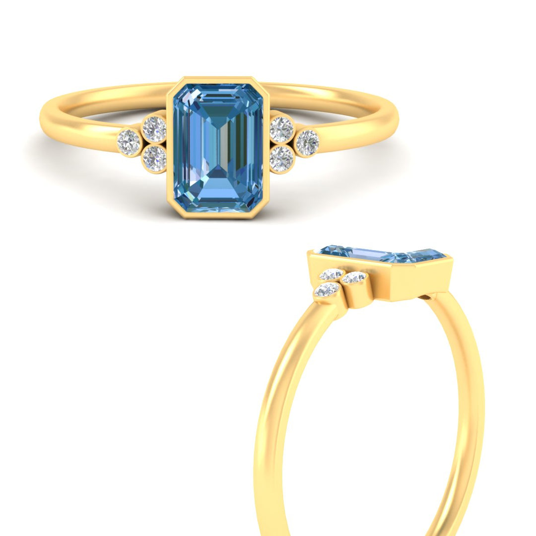 petite-bezel-set-emerald-cut-vivid-blue-engagement-ring-in-yellow-gold-fdenr9175emgvblueangle3-nl-yg.jpg