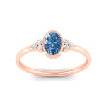 Load image into Gallery viewer, petite-bezel-set-oval-shaped-vivid-blue-engagement-ring-in-rose-gold-fdenr9175ovgvblueangle5-nl-rg.jpg
