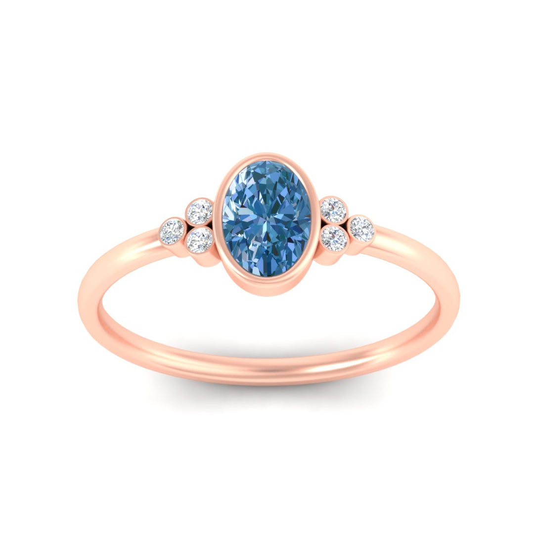 petite-bezel-set-oval-shaped-vivid-blue-engagement-ring-in-rose-gold-fdenr9175ovgvblueangle5-nl-rg.jpg